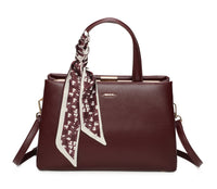 BURGUNDY HARDBACK HOLDALL HANDBAG WITH SCARF TIE AND LONG STRAP