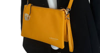 SMALL MULTI-POCKET CROSS BODY CLUTCH BAG WITH WRISTLET - YELLOW