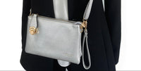 SMALL MULTI-POCKET CROSS BODY CLUTCH BAG WITH WRISTLET - SILVER