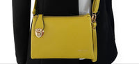 SMALL MULTI-POCKET CROSS BODY CLUTCH BAG WITH WRISTLET - LIGHT YELLOW