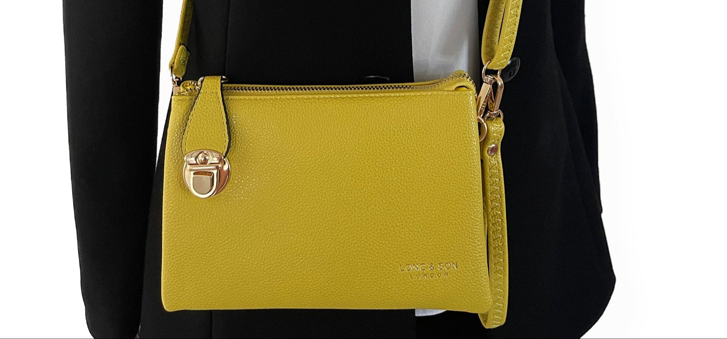SMALL MULTI-POCKET CROSS BODY CLUTCH BAG WITH WRISTLET - LIGHT YELLOW